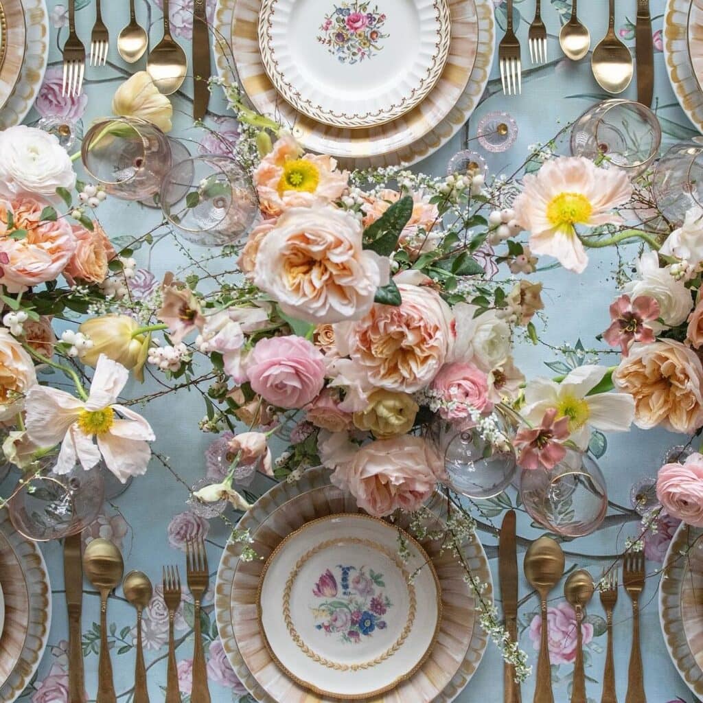 Elegant floral table setting with vintage plates.