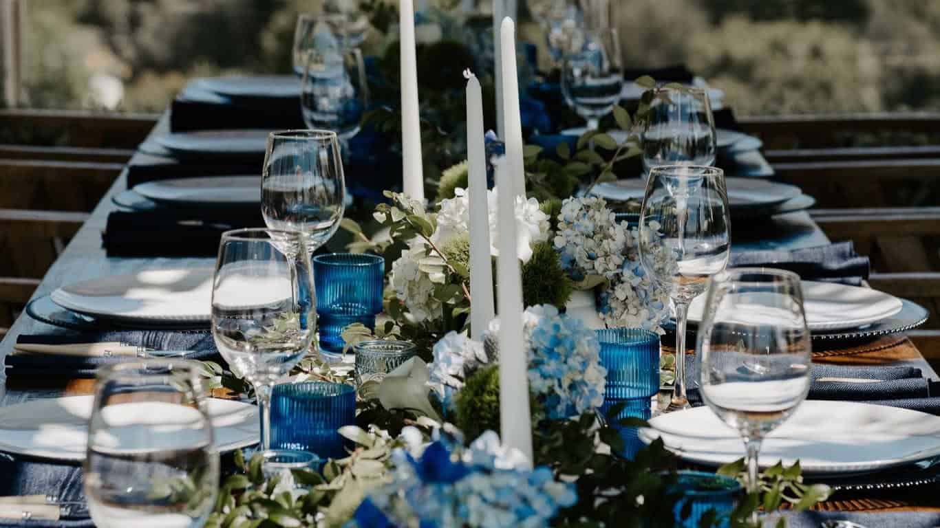Bespoke floral table runner with blue hydrangeas and white candles designed by Flower Gypsies for the Unilever FIFA World Cup 2026 event at The West Hollywood EDITION